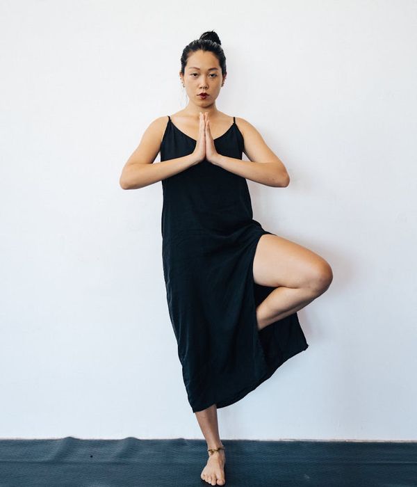 Woman in a graceful yoga pose illustrating inner balance.